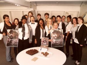 Grou pf women with fake moustaches for movember